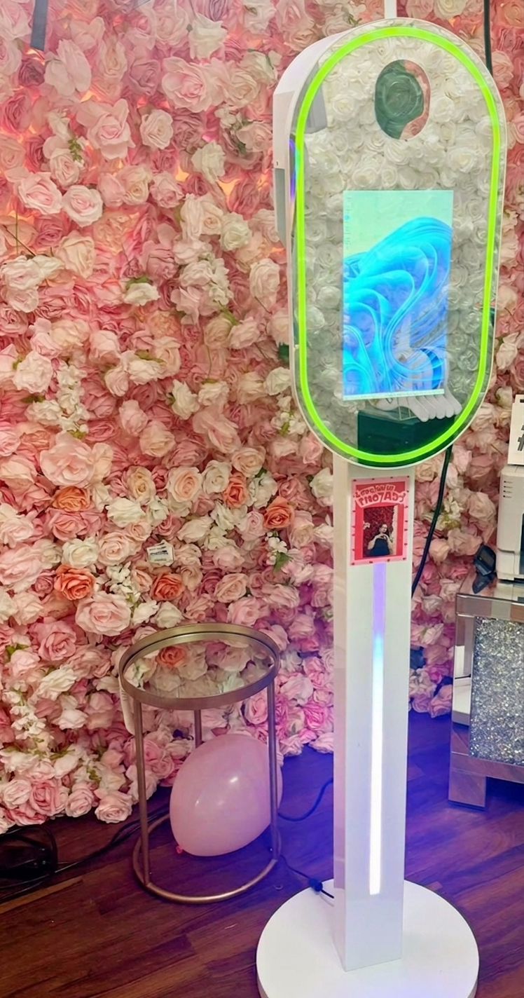 Stationary photo booth in front of the roses.